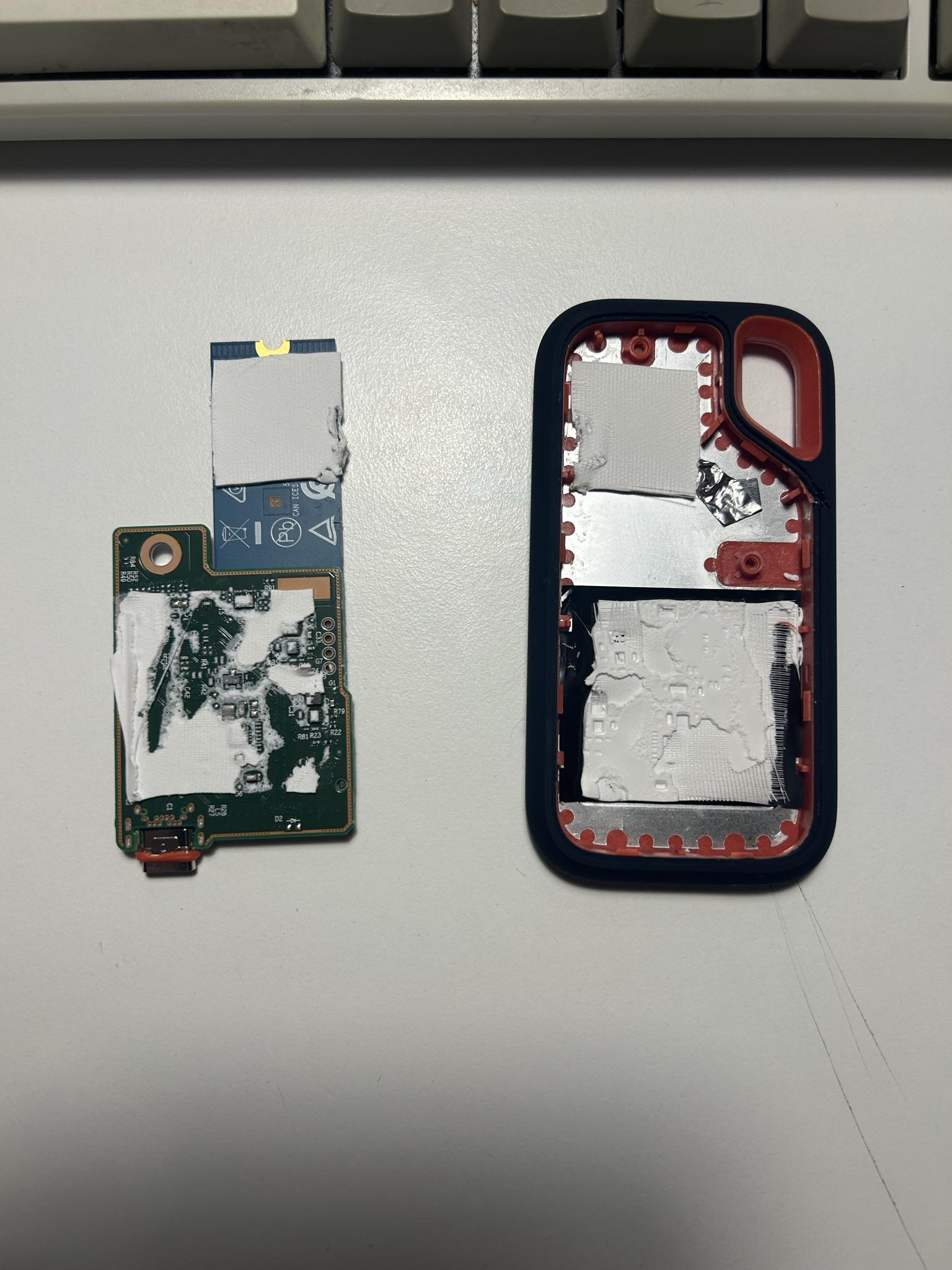 The board and enclosure peeled apart. More thermal paste. Why does this thing have so much thermal paste.
